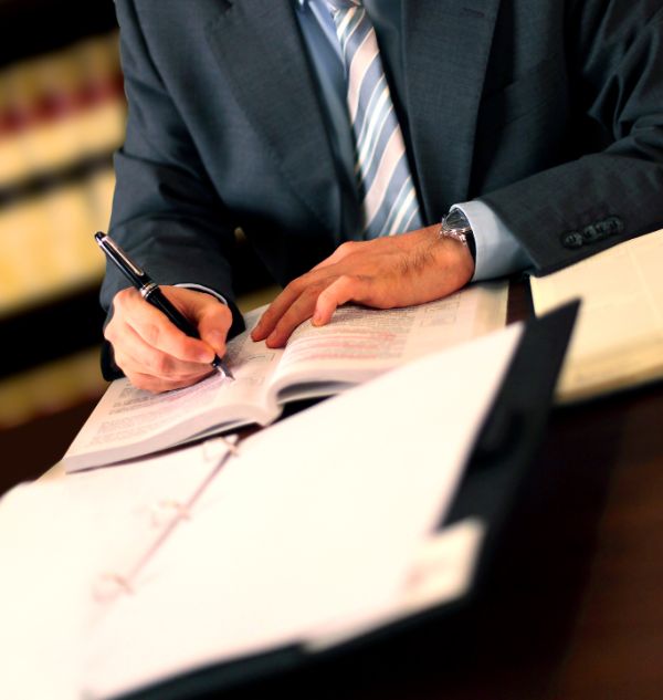 person taking notes in a notebook